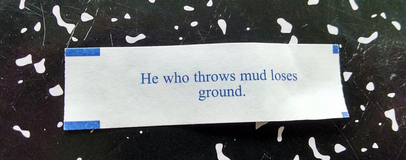 he who throws mud loses ground. Photo of Chinese Fortune Cookie